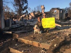 Steve and Mary Schneider standing in the ruins of their Sonoma County homes following the 2017 Tubbs Wildfire.